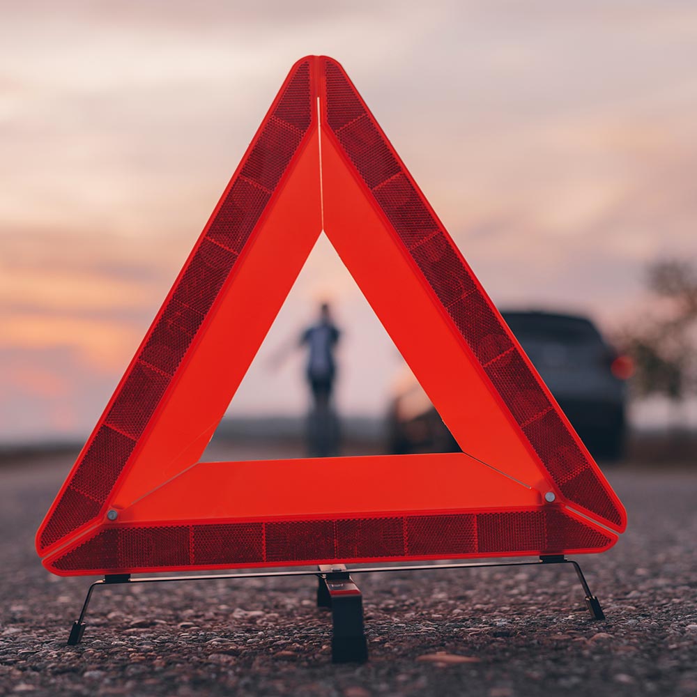 A warning triangle sign on the road.